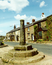 [vertical column in a stone plinth]