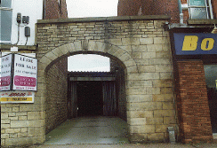 [stone gateway between buildings]