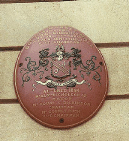 [red and gold date plaque]
