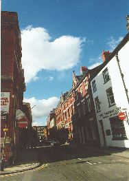 [red brick buildings in street]