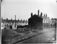[terraced houses being demolished]