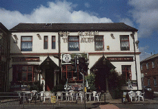 [pub with hanging baskets]
