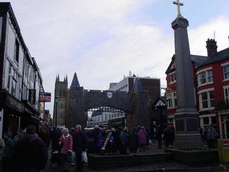[market cross people and replica arch]
