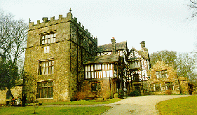 [Stone Tower and Tudor building]