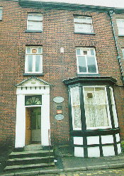 [house frontage with plaque]